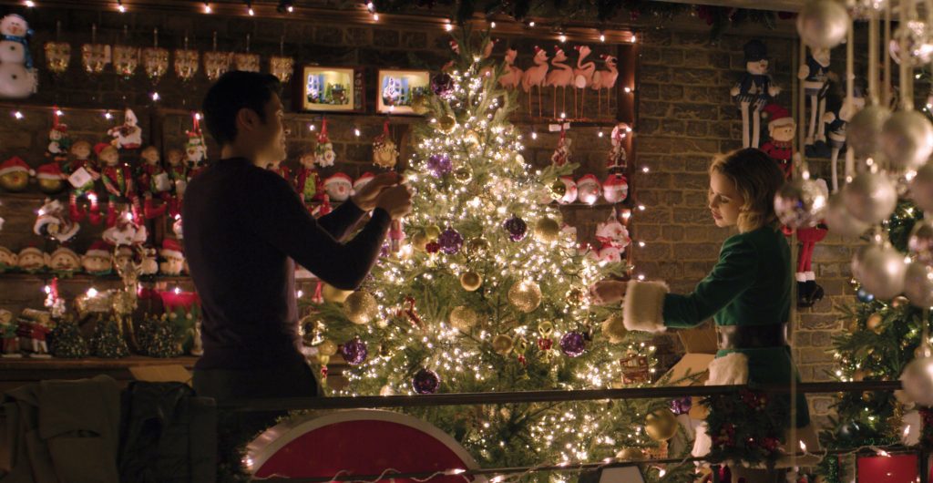 Kate and Tom decorating the Christmas tree.