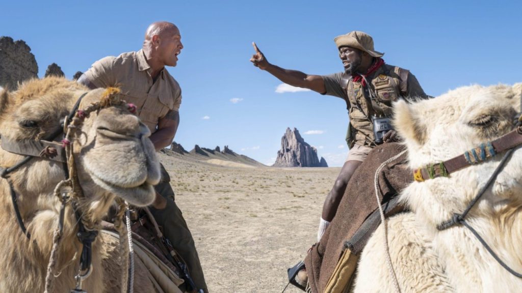 Dwayne Johnson and Kevin Hart on arguing while riding on camels in Jumanji: The Next Level.