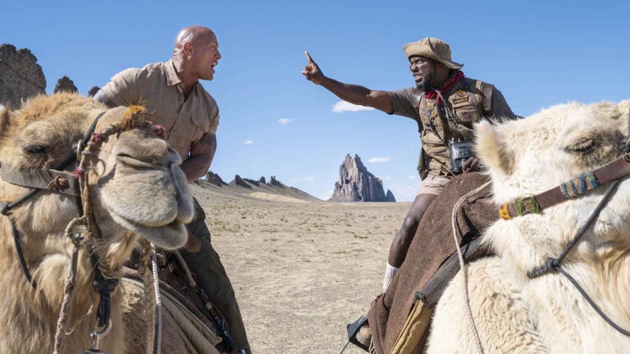 Dwayne Johnson and Kevin Hart on arguing while riding on camels in Jumanji: The Next Level.