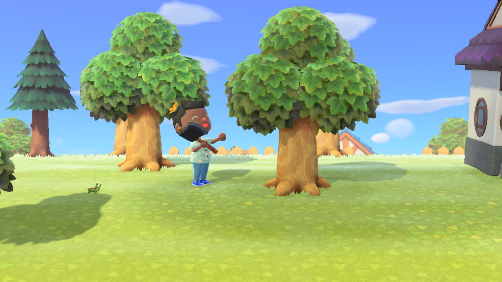 Look at how happy I am chopping down this tree in Animal Crossing: New Horizons.