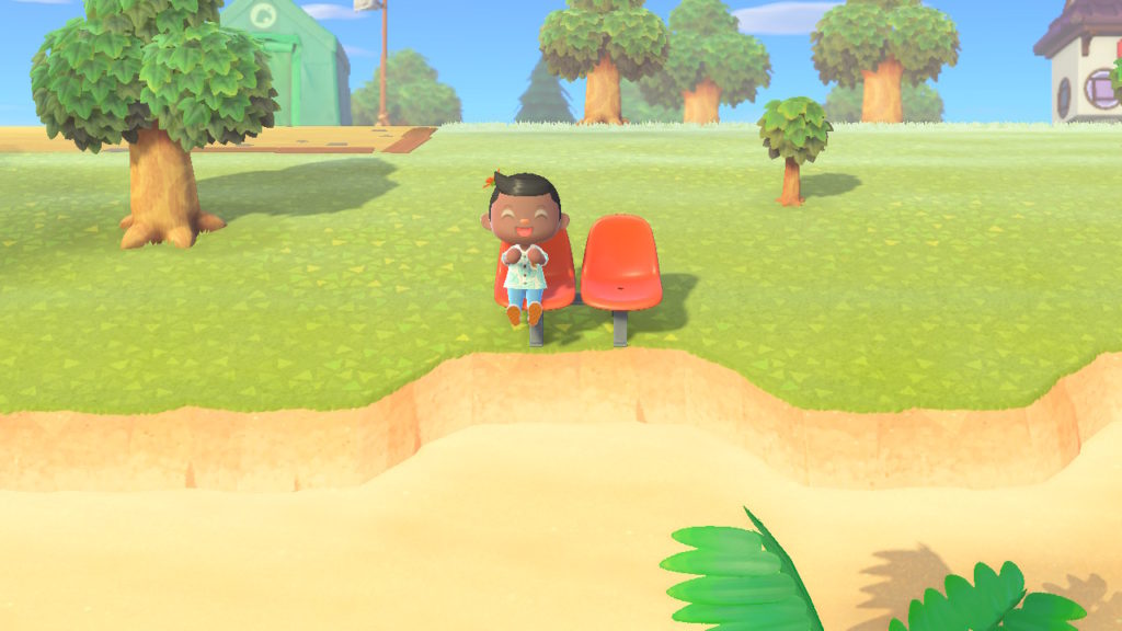 Here I am, just chilling on a bench in Animal Crossing: New Horizons.