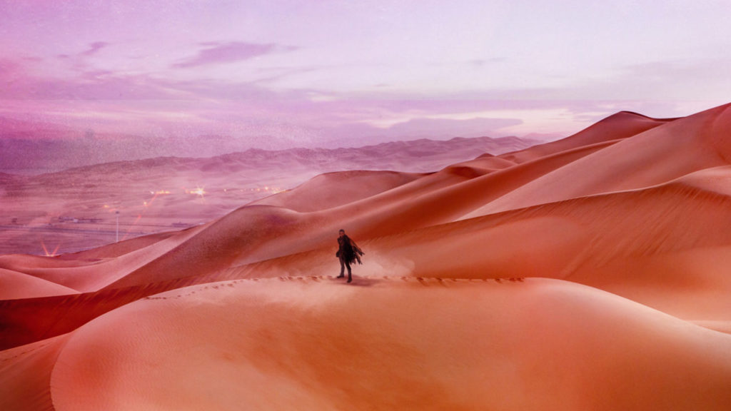 Paul standing on the dunes of the desert planet Arrakis.