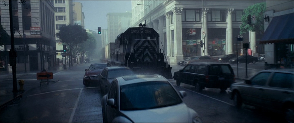 A train runs through downtown in a sequence from Inception.