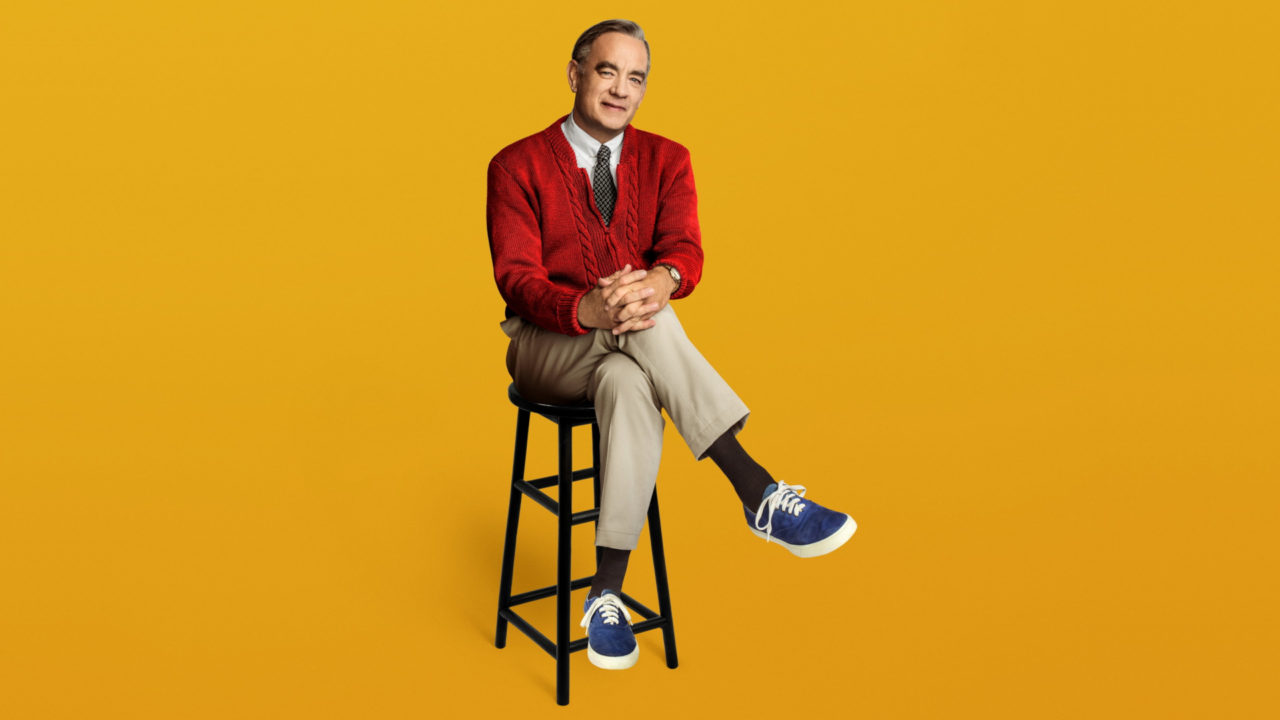 Tom Hanks is Fred Rogers in A Beautiful Day in the Neighborhood.