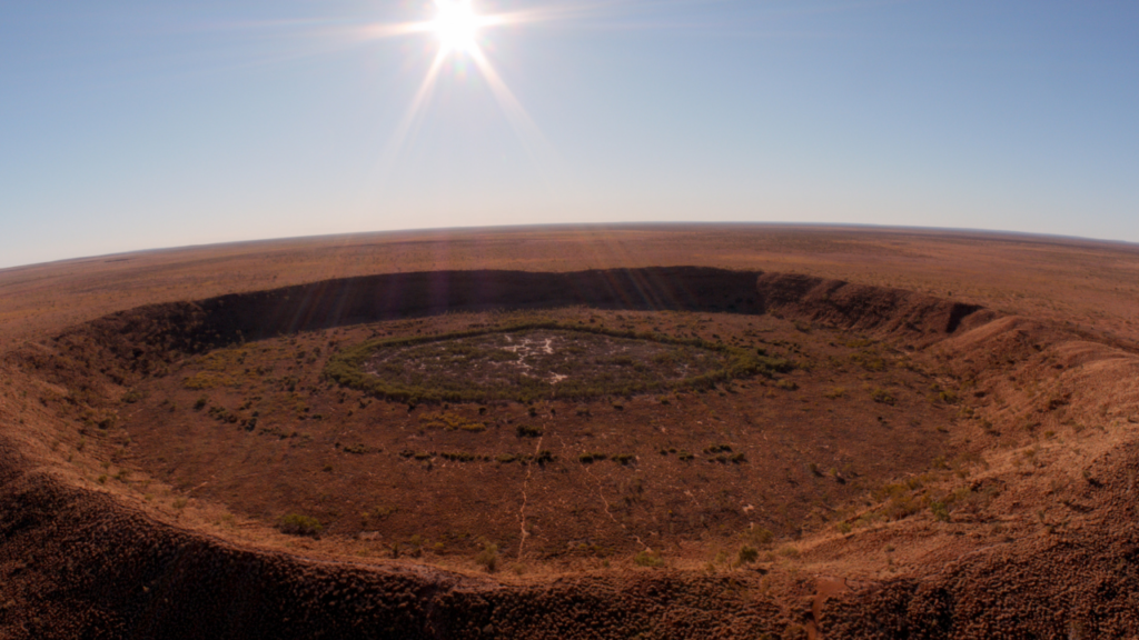 A crater in Wolfe Creek, Western Australia in Fireball: Visitors From Darker Worlds.