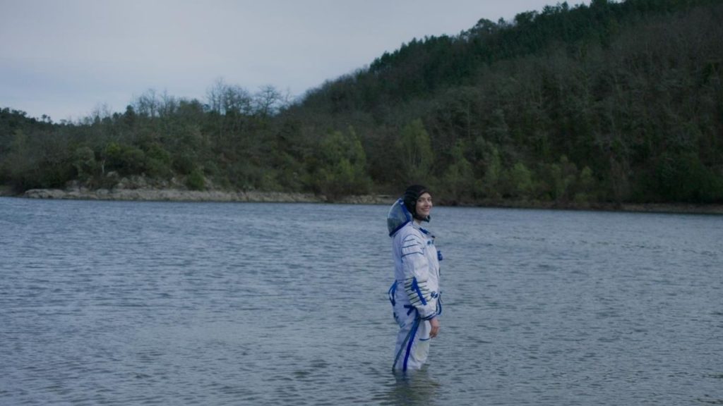 Eva Green standing in the middle of a lake in Proxima.