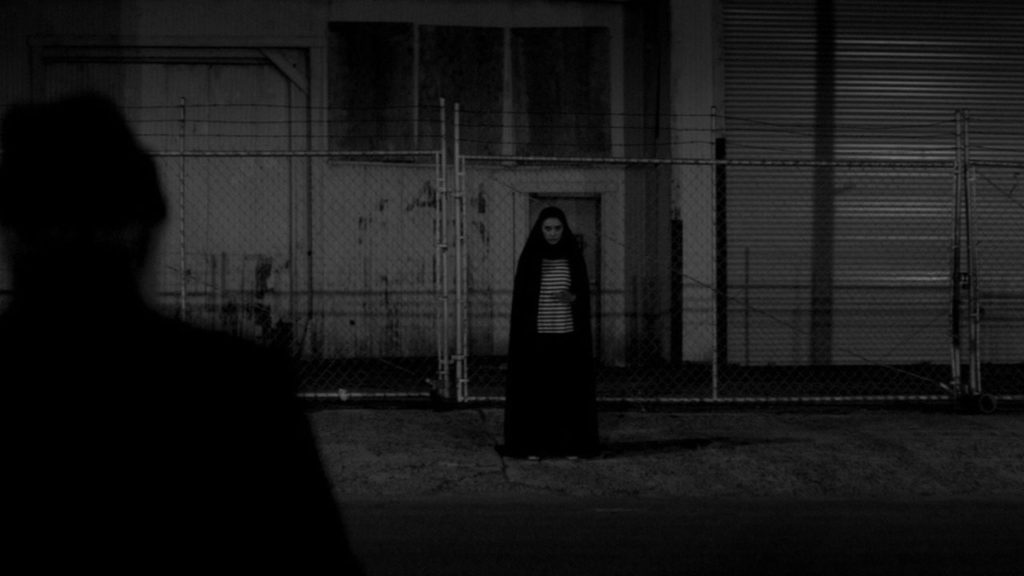 The Girl scoping out her potential next victim in A Girl Walks Home Alone At Night.